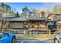 Exterior shot of a cozy home with a balcony and serene setting at 104 River Run Dr, Atlanta, GA 30350