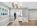 Cozy dining room with chandelier and view to updated kitchen at 117 Lablanc Nw Way, Atlanta, GA 30327