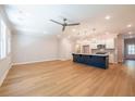 Open concept living space featuring hardwood floors, recessed lighting and modern ceiling fan at 1604 Ruskin Way, Marietta, GA 30062