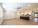 Spacious kitchen featuring a large island, stainless appliances, stylish pendant lighting, and an open floor plan at 1612 Ruskin Way, Marietta, GA 30062