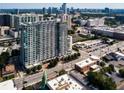 Modern high-rise in the heart of the city with a vibrant cityscape and lush greenery surrounding the building at 250 Pharr Ne Rd # 318, Atlanta, GA 30305