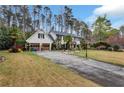 Beautiful home with a spacious driveway and well-maintained lawn, perfect for outdoor activities at 4970 Lakeland Woods Ct, Atlanta, GA 30338