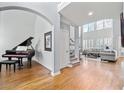 Spacious entryway with gleaming hardwood floors, grand piano and soaring ceilings at 1657 Wilkinson Se Way, Smyrna, GA 30080