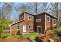 Delightful two-story home showcasing a well-manicured lawn and inviting entrance at 279 Alex St, Canton, GA 30114