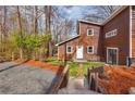 Stylish home featuring a welcoming entryway, lush lawn, and unique architecture at 279 Alex St, Canton, GA 30114