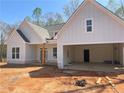 Charming new construction with an attached garage, covered front entrance, and classic white siding at 270 Harmony Woods Dr, Dallas, GA 30157
