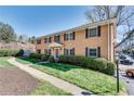 Brick apartment building featuring well-maintained landscaping, visible walkway and parking at 3510 Nw Roswell Nw Rd # J1, Atlanta, GA 30305