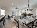 Open floorplan showcases a dining area, and a living room with abundant natural light and modern furnishings at 4527 Moray Dr, Mableton, GA 30126