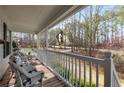 Cozy front porch featuring wicker furniture, perfect for relaxing outdoors at 673 Waters Rd, Hiram, GA 30141