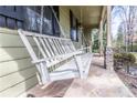 Relaxing porch swing on a stone-paved porch, offering a cozy spot to enjoy the outdoors at 1767 Wingard Dr, Marietta, GA 30062