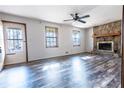 Bright living room featuring wood-look floors and a stone fireplace, creating a warm and inviting atmosphere at 1767 Wingard Dr, Marietta, GA 30062