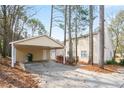 View of the side of the home featuring a large carport for parking and a back deck for relaxation at 34 Kelso At Peyton Dr, Atlanta, GA 30311