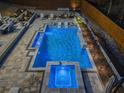 Aerial view of the backyard pool with spa and lounge area, perfect for relaxation at 4080 Glen Hill Ne Way, Marietta, GA 30066