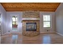 Inviting living room with a stone fireplace, vaulted ceilings, and hardwood floors at 3572 Dexter Way, Marietta, GA 30062