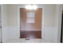 Bright living room with hardwood floors and an open view into another room at 4473 Marjorie, Snellville, GA 30039