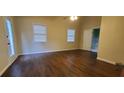 Spacious main bedroom with hardwood floors, ceiling fan, and ensuite bathroom at 4473 Marjorie, Snellville, GA 30039