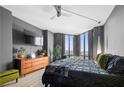 This primary bedroom suite features floor-to-ceiling windows and hardwood floors at 2870 Pharr Ct # 3002, Atlanta, GA 30305