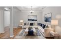 Comfortable living room with stylish décor, a plush sofa, and a cozy atmosphere at 145 Sunset Ln, Woodstock, GA 30189