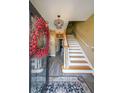 Bright foyer with hardwood floors, stairs, and modern chandelier at 2476 Manor Walk, Decatur, GA 30030