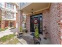 Inviting front door with wreath, decorative shrubbery, and covered porch at 2476 Manor Walk, Decatur, GA 30030