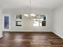 A spacious living room featuring hardwood floors and large windows at 6206 Redan Overlook, Lithonia, GA 30058