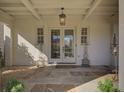 Charming front door with sidelights and a decorative pendant light for a warm welcome at 81 Delmont Ne Dr, Atlanta, GA 30305