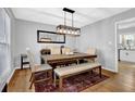 Dining room with modern lighting, hardwood floors, and a cozy rug at 2113 N Landing Way, Marietta, GA 30066