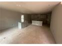 Spacious unfinished kitchen featuring ample cabinet space and a large center island area at 75 Emerald Ln, Covington, GA 30014