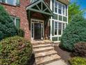 Stone steps lead to the inviting covered front porch and front door of this charming home at 102 Stargaze Rdg, Canton, GA 30114
