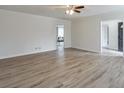 Open living room showcasing new wood flooring, neutral paint, and lots of open space at 3285 Mitsy Forest Ne Way, Marietta, GA 30068