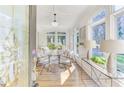 Bright, airy living room with large windows, hardwood floors, and stylish furnishings, accessible from an ornate glass door at 232 Westminster Ne Dr, Atlanta, GA 30309