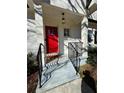 Charming front entrance featuring a bright red door and iron railing at 827 Derrydown Way, Decatur, GA 30030