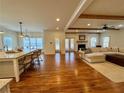 Spacious living room and kitchen with hardwood floors and ample natural light at 827 Derrydown Way, Decatur, GA 30030