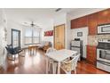 Open-concept space combining kitchen and dining area, with hardwood floors and natural light at 898 Oak Sw St # 3222, Atlanta, GA 30310