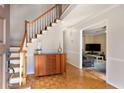 Welcoming foyer with hardwood floors, staircase, and decorative details at 1135 Banbury Cross, Avondale Estates, GA 30002