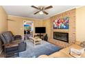 Inviting living room with brick fireplace, plush seating, and ample natural light at 1135 Banbury Cross, Avondale Estates, GA 30002