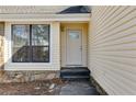 Close-up of the front door and entryway, showcasing the home's curb appeal at 9760 Greenside Way, Douglasville, GA 30135