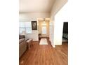 Bright entryway with wood floors and a view into other rooms of the house at 317 Glens Way, Woodstock, GA 30188