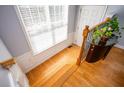 Bright foyer with hardwood floors, decorative wainscoting, and natural light at 402 Iona Abbey Se Ct, Smyrna, GA 30082