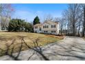View of a home with a long driveway and large front lawn at 4312 Daniel Dr, Winston, GA 30187