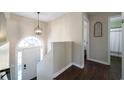 Bright foyer with hardwood floors and modern lighting fixture at 4312 Daniel Dr, Winston, GA 30187