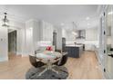 Open-concept kitchen and dining area with stainless steel appliances and a spacious island at 4827 Basingstoke Dr, Suwanee, GA 30024
