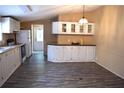 Well-equipped kitchen with updated appliances and ample cabinet space at 59 Pine Ridge Ln, White, GA 30184