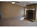 View of the spacious living room with a stone fireplace and neutral carpet at 59 Pine Ridge Ln, White, GA 30184