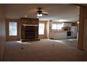 Inviting living room with a stone fireplace, ceiling fan, and lots of natural light at 59 Pine Ridge Ln, White, GA 30184