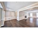 Spacious living room with a fireplace and hardwood floors, providing a cozy and inviting atmosphere at 1095 Willow Bnd, Roswell, GA 30075