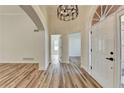 Open foyer featuring hardwood floors, high ceilings, and abundant natural light at 3535 Southmont Ct, Cumming, GA 30041