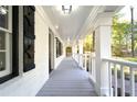 Charming porch with white columns, providing a relaxing outdoor space at 610 Walnut Sw Pl, Marietta, GA 30060