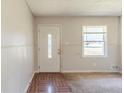 Bright entryway with a decorative front door and neutral-toned walls at 6050 Randy Ln, Ellenwood, GA 30294