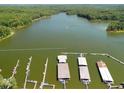 Stunning aerial view showcasing the lake with docks and boat slips, perfect for water enthusiasts at 804 Allatoona Crst, Woodstock, GA 30189